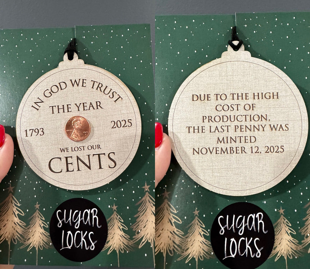 Front and back of a double-sided 2025 penny keepsake wooden ornament with engraved historical wording