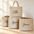 Natural canvas totes with individual script names including Ella, Gianna and Sanai