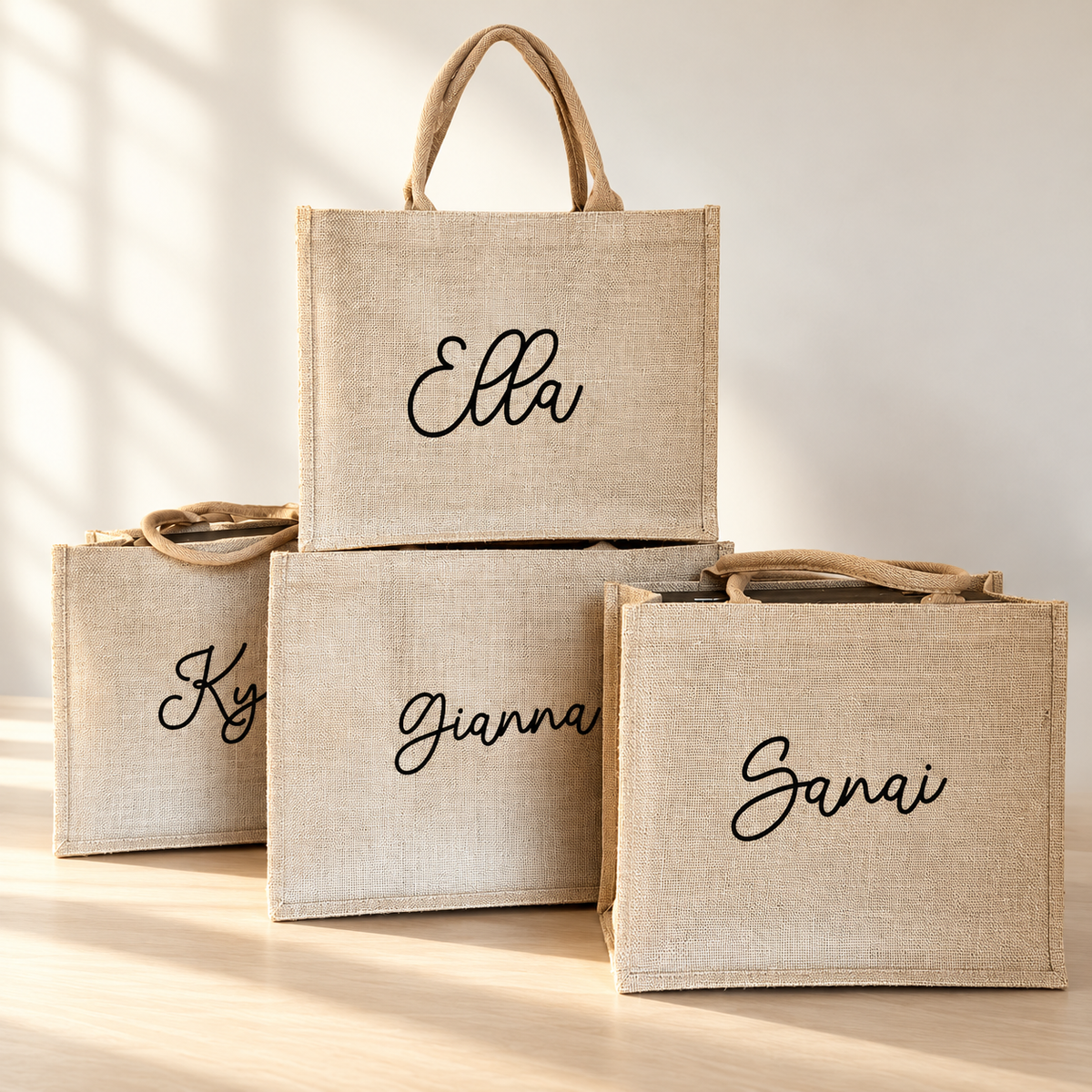 Natural canvas totes with individual script names including Ella, Gianna and Sanai