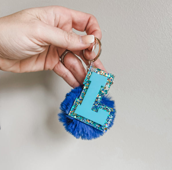 Initial acrylic keychains with Poms
