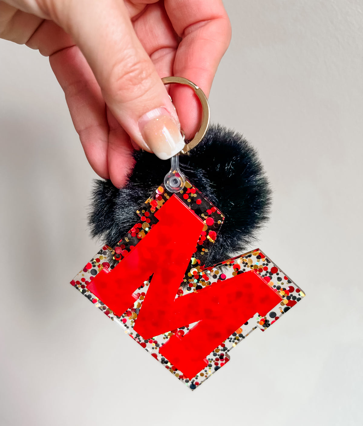 Initial acrylic keychains with Poms