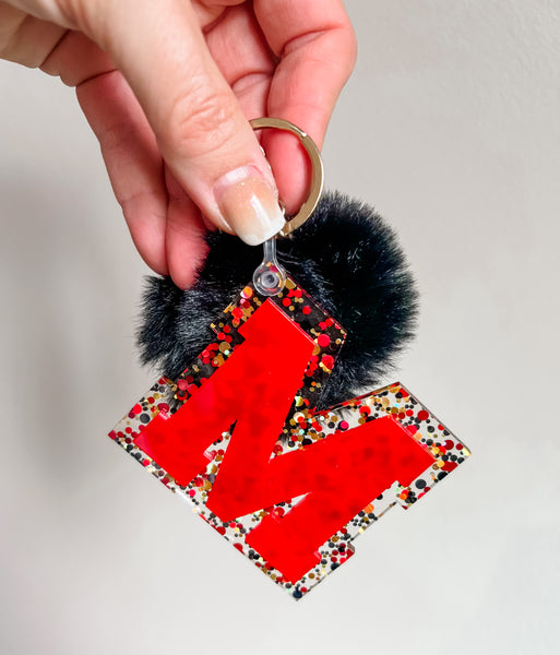 Initial acrylic keychains with Poms