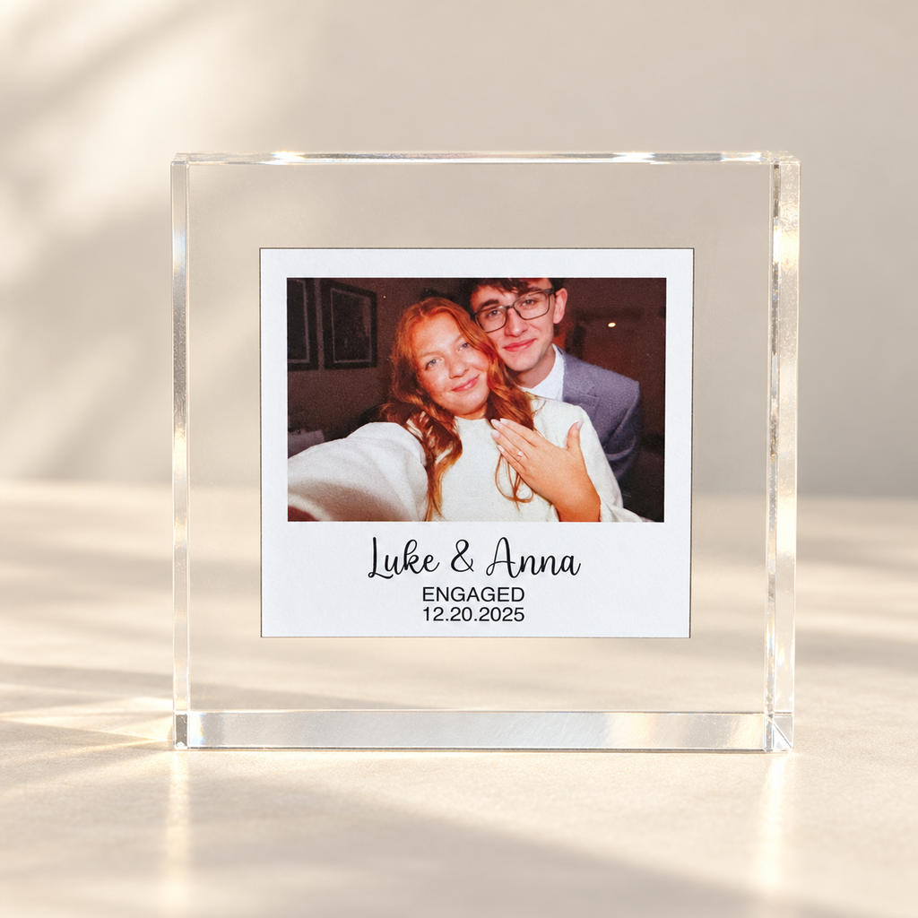 Freestanding clear acrylic photo block with instant-photo-style couple picture and personalized names and date