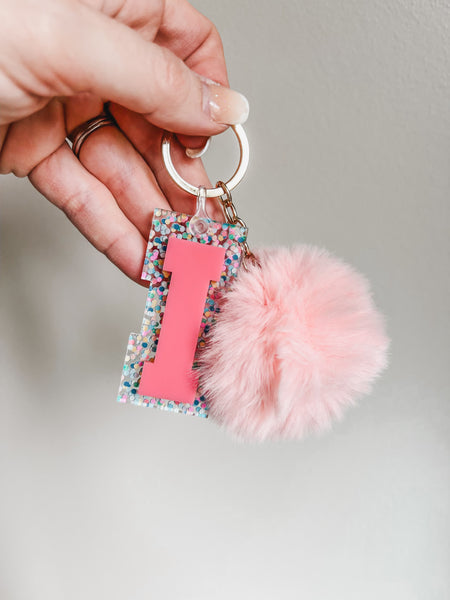 Initial acrylic keychains with Poms