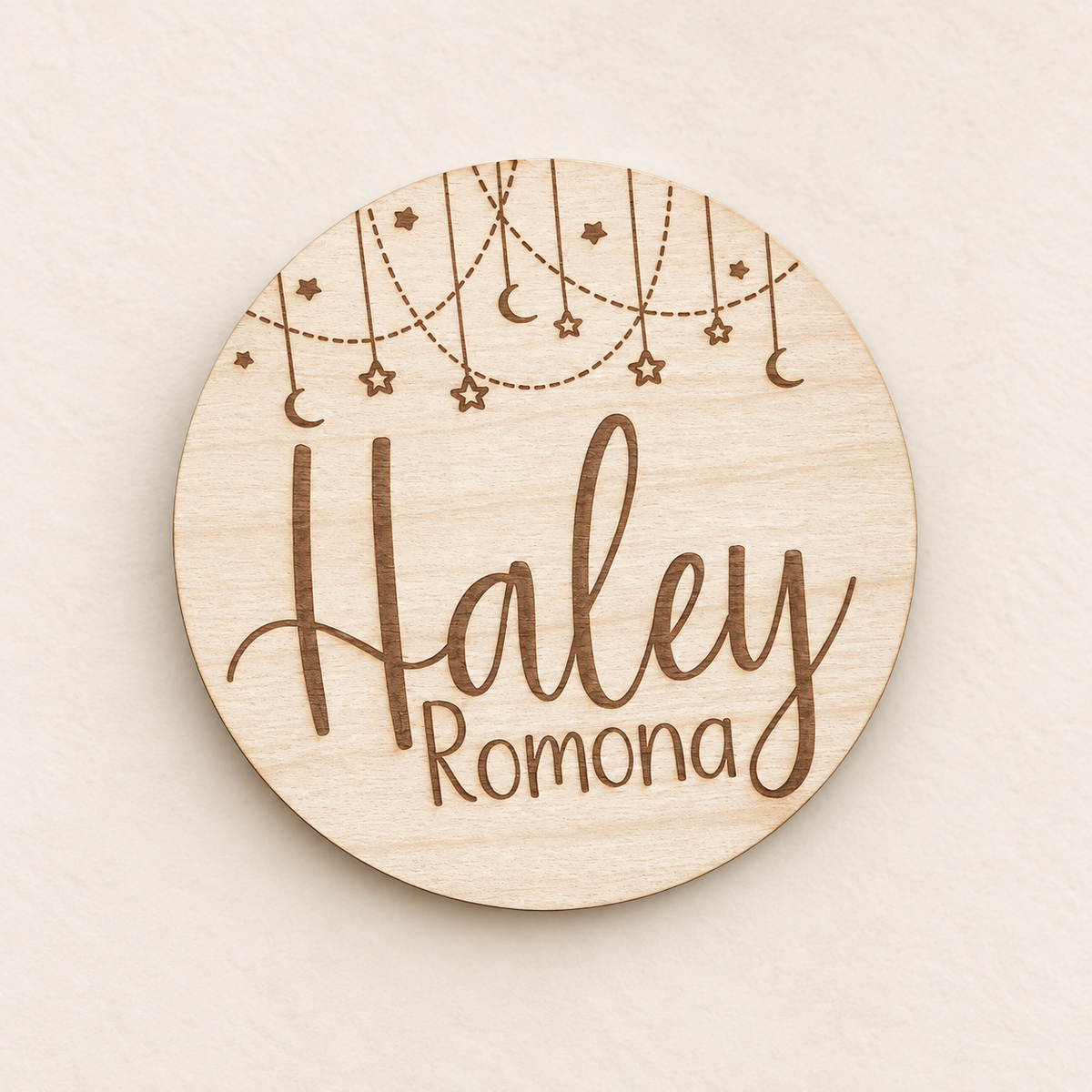 Personalized wooden baby name announcement round with hearts, stars and moons