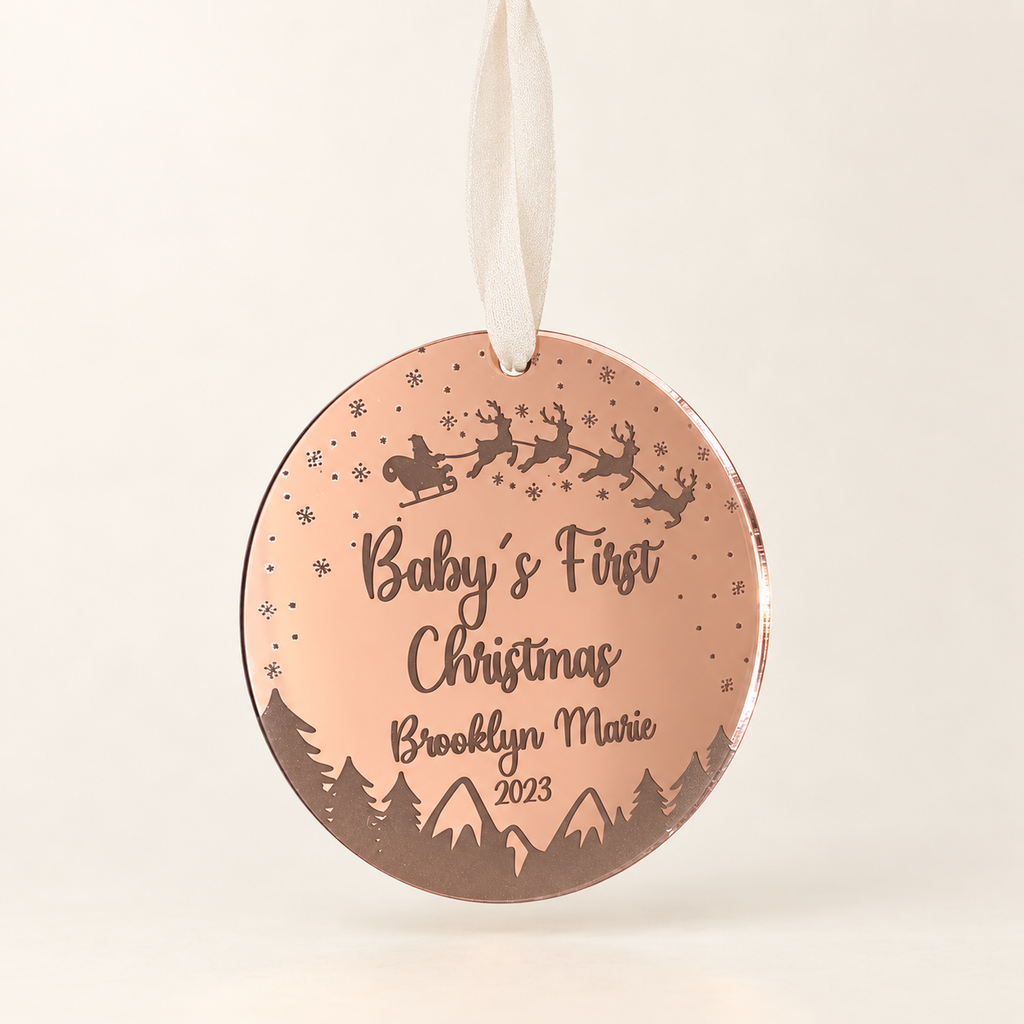 Rose gold Baby’s First Christmas ornament personalized with baby name and year