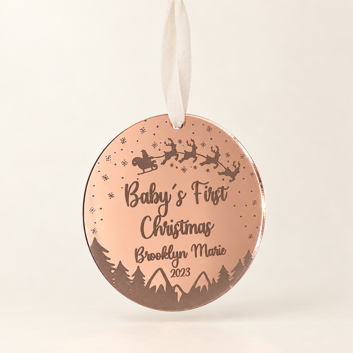 Rose gold Baby’s First Christmas ornament personalized with baby name and year