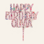 Personalized Happy Birthday Olivia pink glitter-flake acrylic cake topper on a cream background