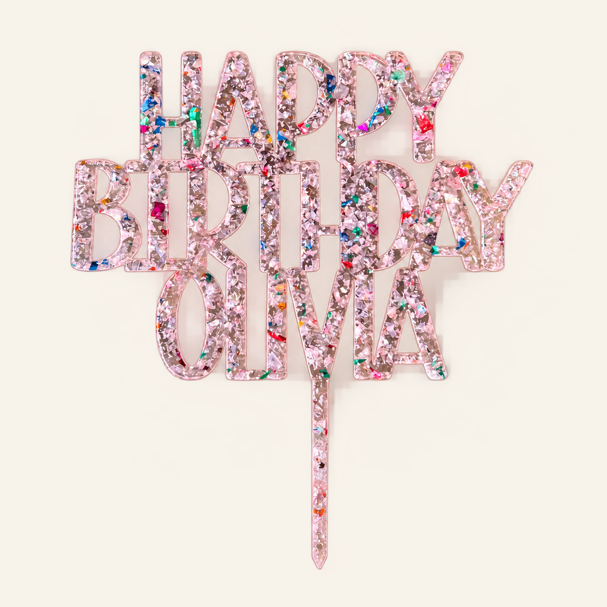 Personalized Happy Birthday Olivia pink glitter-flake acrylic cake topper on a cream background