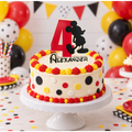 Personalized red black and yellow mouse-themed wood cake topper with age four and the name Alexander displayed on a birthday cake
