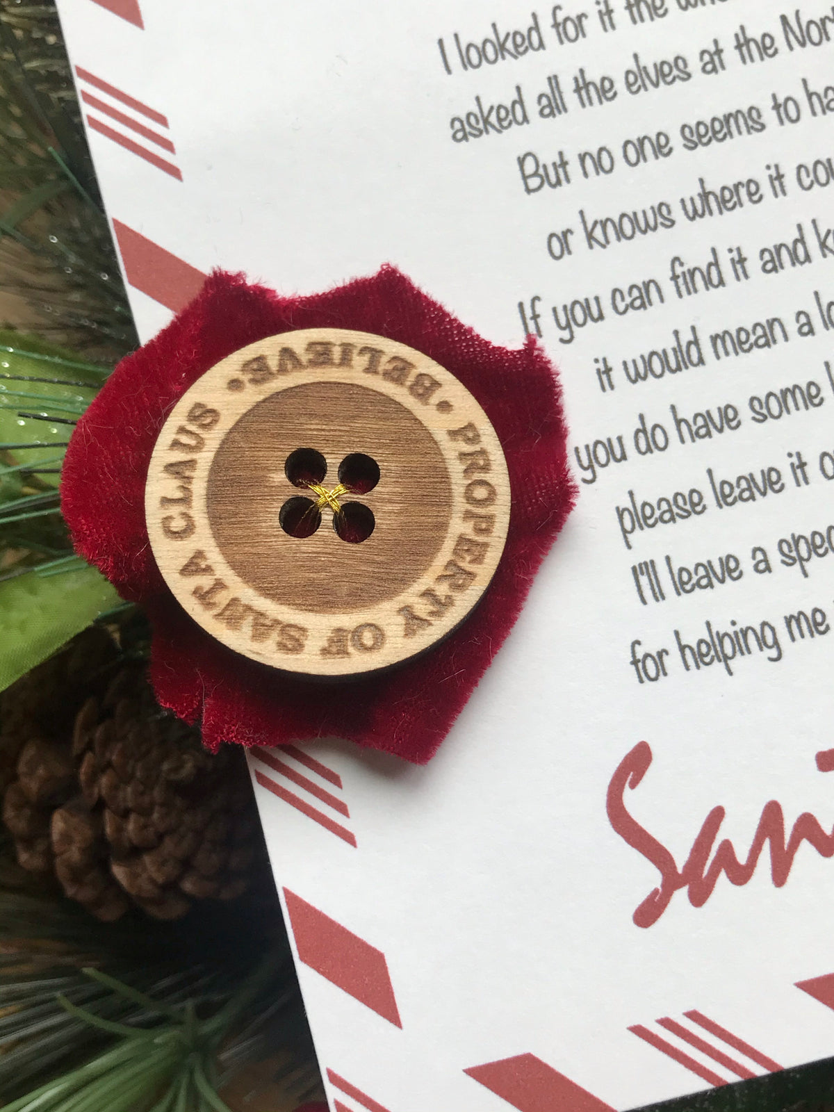 Santa’s lost button with letter